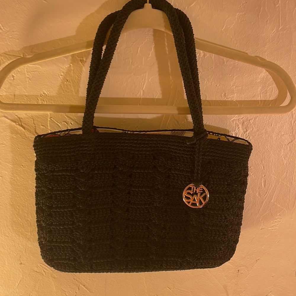 SAK Black Knitted Purse w/small Accent Medallion with Beautiful Print Lining